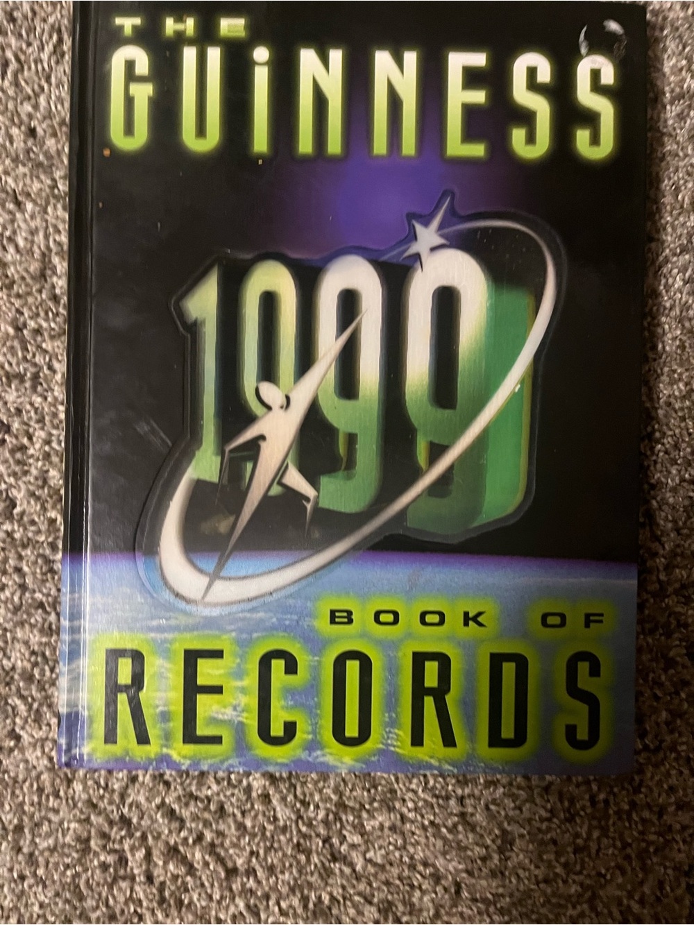 Guinness World Records Book with Black and Purple Gradient Cover